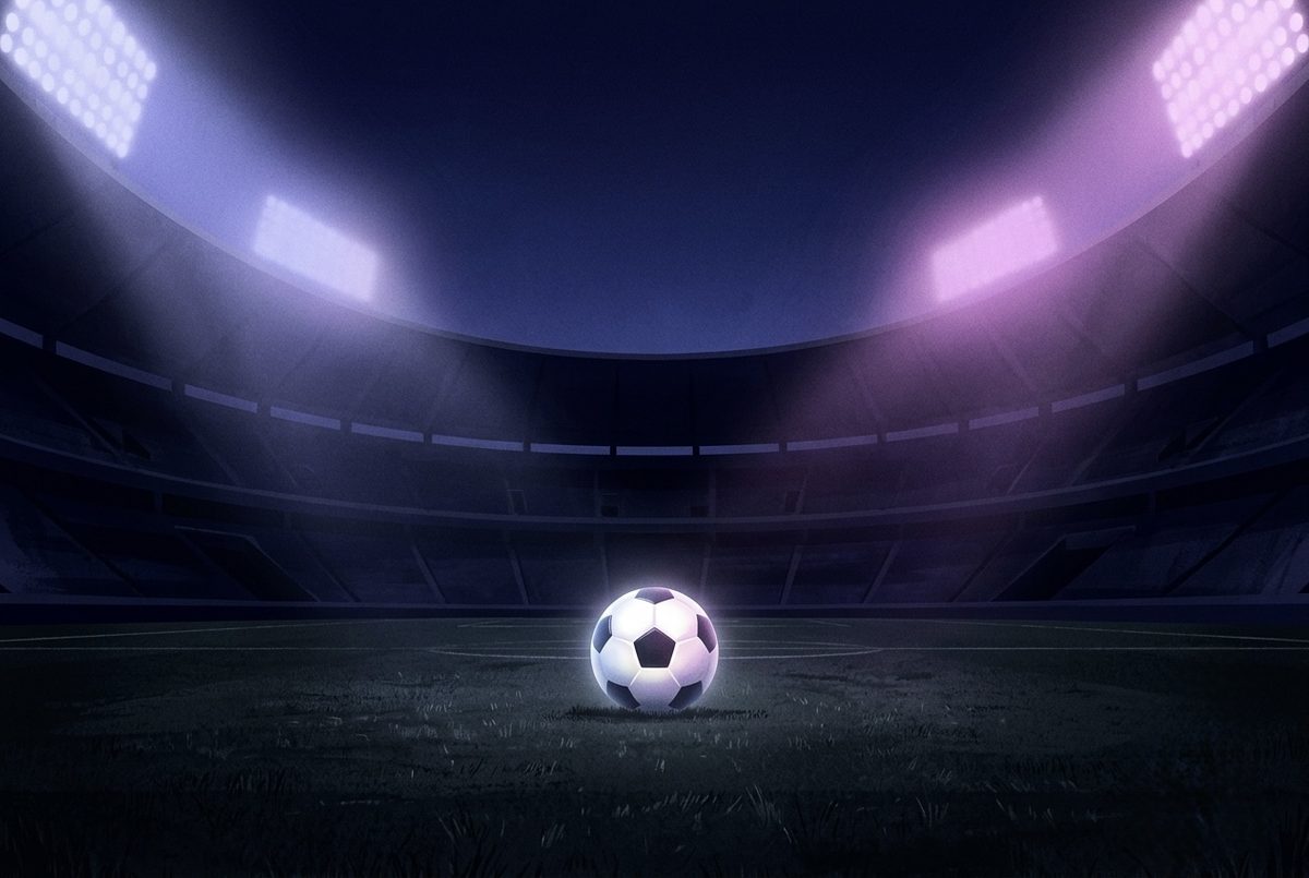 A glowing soccer ball at the center of a dark stadium under floodlights.